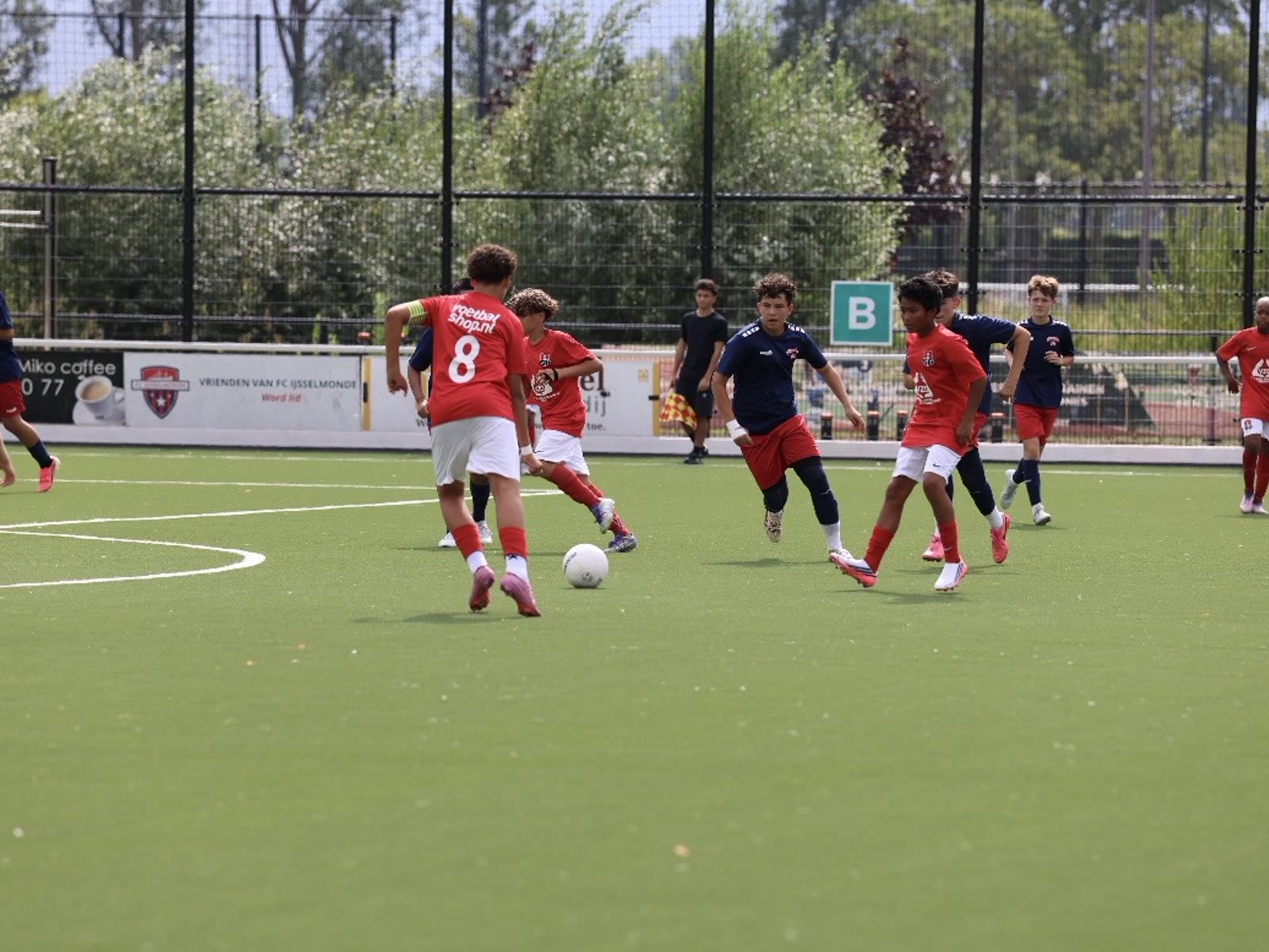 Coach leading a professional football training session in the Netherlands